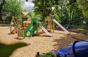 a park with a playground with a slide at De Berghut Durbuy - Chalet nr 104 in Durbuy