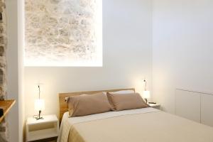 Ένα ή περισσότερα κρεβάτια σε δωμάτιο στο Rihal Rooms