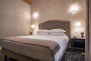 Postel nebo postele na pokoji v ubytování Roma suite hotel + 76 fotografií