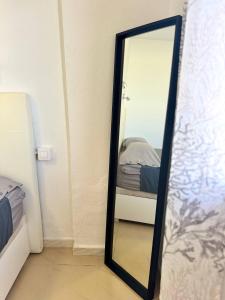 a mirror in a room with a bed at Elixir Estate in Antigua +27 photos