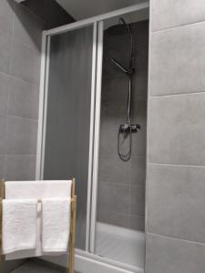 a shower with a glass door in a bathroom at WoW San Miniato in San Miniato +20 photos