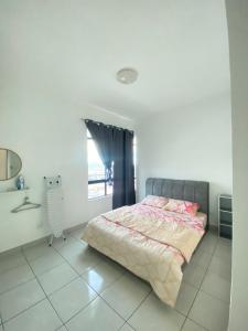a bedroom with a bed and a window at Ai Lee Haven in Papar