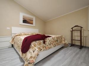 a bedroom with a bed with a blanket on it at WoW San Miniato in San Miniato