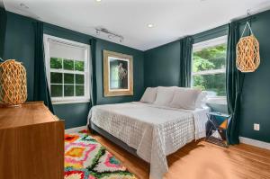 a bedroom with a bed and two windows at Bachelorette Retreat in Nashville in Providence