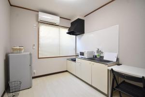 Kuchyň nebo kuchyňský kout v ubytování Guest House -SASAKI-