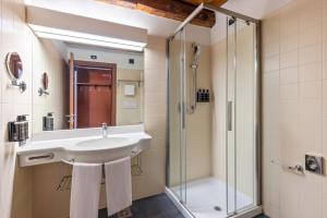 a bathroom with a sink and a shower at Eurostars Residenza Cannaregio in Venice +55 photos