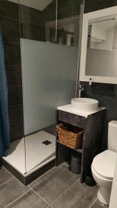 a bathroom with a sink and a toilet at Lamaisonxv in Crest