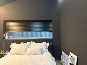 En eller flere senge i et værelse på gwangju-stay-dosim