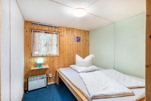 Ένα ή περισσότερα κρεβάτια σε δωμάτιο στο Bungalow 6 - Finnhütte