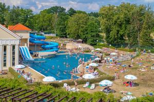 a group of people in a pool at a water park at Imperial Spa & Kurhotel in Františkovy Lázně