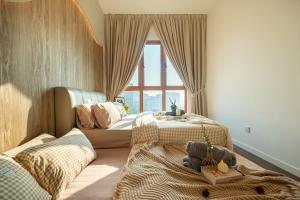 a childs bedroom with two beds and a window at BUKIT JALIL Cute Coffee House Vibes KIDS Room in Kuala Lumpur +63 photos