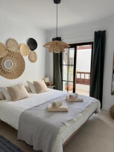 En eller flere senge i et værelse på El Oasis de NaLi - Playa Grande