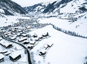 a village covered in snow in a valley at Goldberg-Aparts Berg in Seidlwinkl