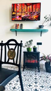 a living room with a chair and a fire place at Art House in Batumi +29 photos