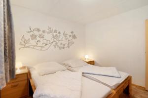 Ένα ή περισσότερα κρεβάτια σε δωμάτιο στο Bungalow 14 - Finnhütte