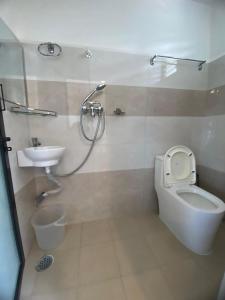 a bathroom with a toilet and a sink at The hills in Pokhara +12 photos