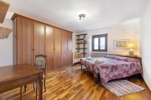 Un pat sau paturi într-o cameră la Il Penzatoio