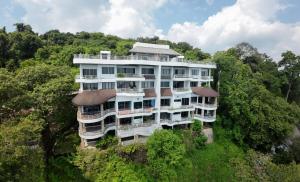 a large building on top of a hill with trees at K5 Seaview Hillside 3BR and 1 Staff Quarter in Ban Ko Kok