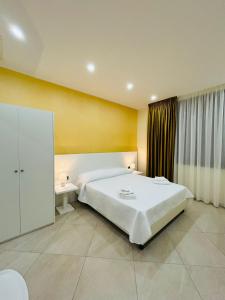 Postel nebo postele na pokoji v ubytování Nuovo Borgo B&B