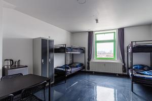 Ένα ή περισσότερα κρεβάτια σε δωμάτιο στο Kapselhotel nähe Hauptbahnhof Halle-Saale