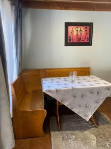a small table in a room next to a wall at Cabañas Casa Blanca in Valdivia