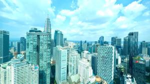 a view of a large city with tall buildings at Vortex Suites KLCC By GuestHouse in Kuala Lumpur
