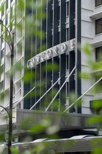 a sign on the front of a corporate building at Concorde Hotel Kuala Lumpur in Kuala Lumpur