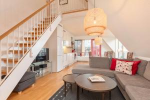 a living room with a couch and a table at Åre Travel - Åre Parken 18 in Åre
