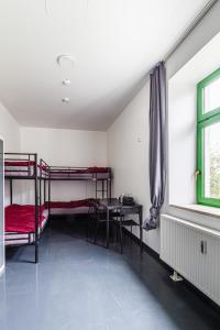 Ένα ή περισσότερα κρεβάτια σε δωμάτιο στο Kapselhotel nähe Hauptbahnhof Halle-Saale