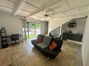 a living room with a couch and a table at The Morrison on Msasa in Randburg