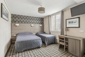 Postel nebo postele na pokoji v ubytování Hotel Telemaque