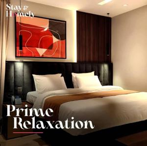 Postel nebo postele na pokoji v ubytování Stay and Homely Hotel