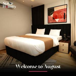 Postel nebo postele na pokoji v ubytování Stay and Homely Hotel