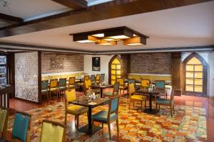 an overhead view of a restaurant with tables and chairs at Zip By Spree Hotels Samudra Belgaum in Belgaum