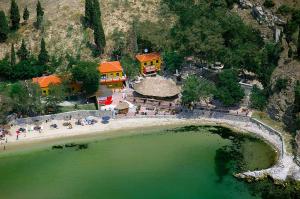 an aerial view of a resort with a pool of green water at Olena House in Kavála