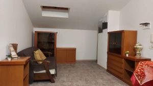 a living room with a couch and a desk at ApartRelax in SantʼEufemia a Maiella