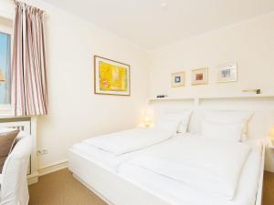 Ένα ή περισσότερα κρεβάτια σε δωμάτιο στο Rasmus 1 von Appartements & Mehr