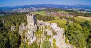 a castle on top of a mountain with a town at pfefferHÄUSL in Regen