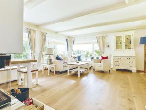 TV a/nebo společenská místnost v ubytování Wattgarten von Appartements & Mehr