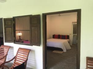 Postel nebo postele na pokoji v ubytování Kadol Villa