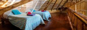 Un pat sau paturi într-o cameră la Archipelago Resort
