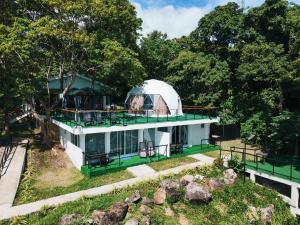 an image of a house with a domed observatory at Txaleta de Camiguin desde 2024 in Mambajao +96 photos
