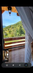 a view out of a window of a train at Cabana La Iura in Bistra