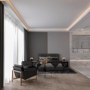 una sala de estar con una cama y un sofá en Sea View Apartments Baku, en Baku