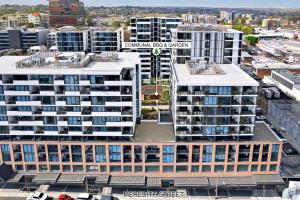 an aerial view of a city with tall buildings at The Luxury Penthouse at Spring Square in Bankstown +7 photos