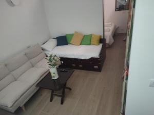 a living room with a couch and a table at La Flavia in Capri