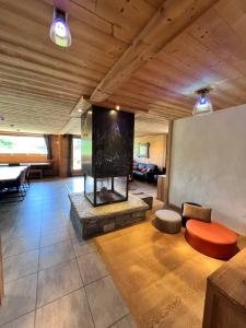 a living room with a fireplace and a large screen at Chalet Virolet in Les Gets