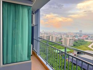 a balcony with a view of a city at Supalai Mare Pattaya & City Center in Pattaya South