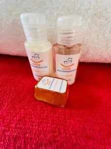two bottles of sunscreen and a bar of soap at Royal Apartments in Burgersfort +9 photos