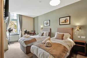a bedroom with two beds and a window at The Lambton in Durham